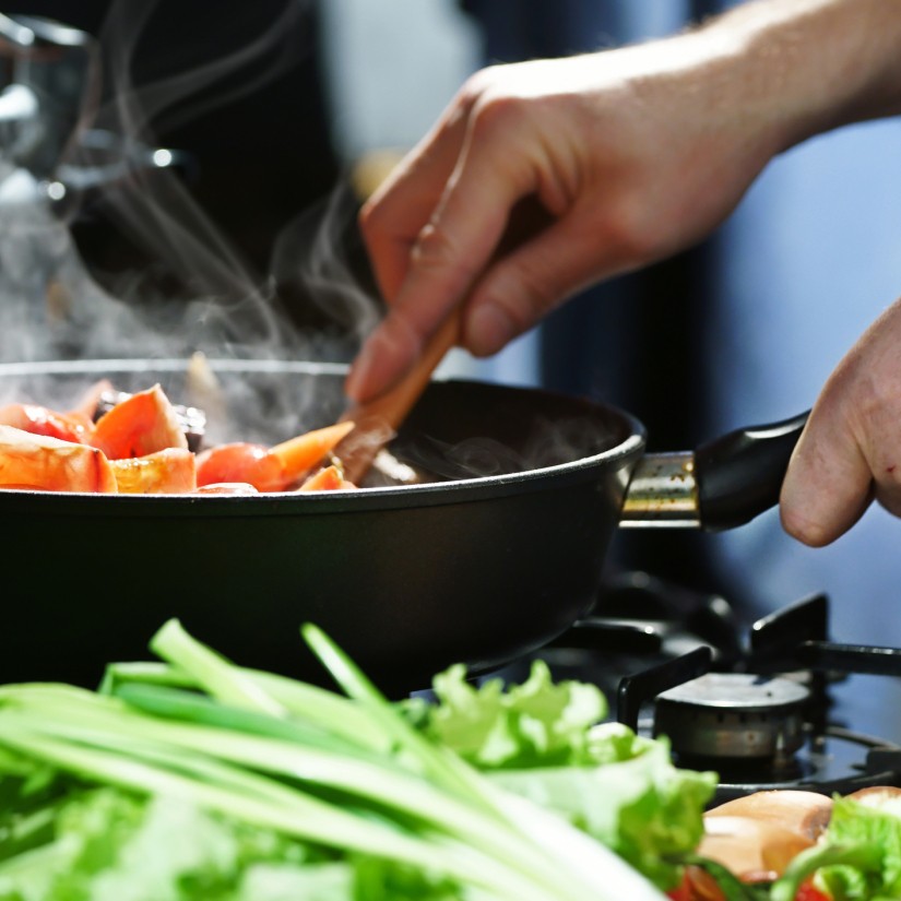 Chef prepares hotpot in the stew pan in the kitchen